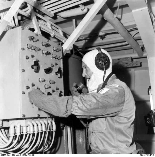 Leading Seaman N Martino, R99720 operates the loader control panel in ...