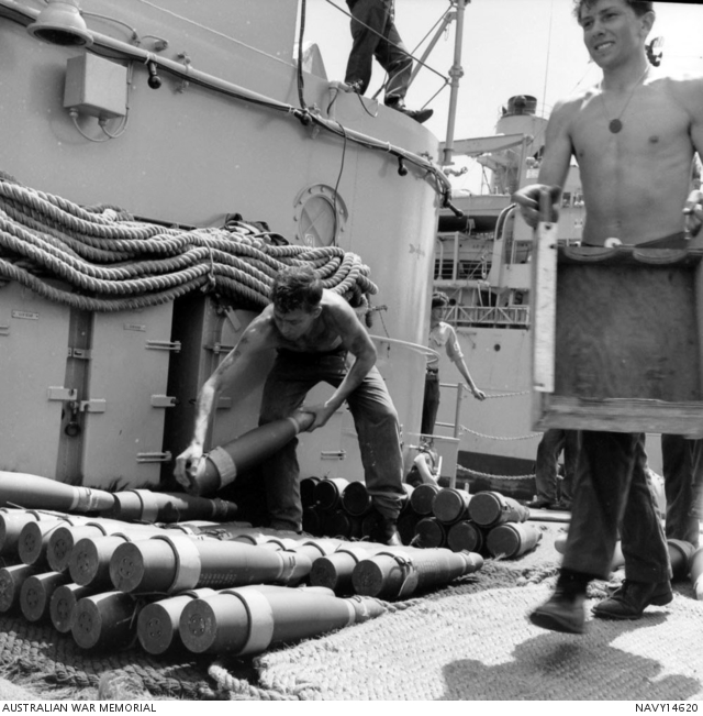 Ammunition is being loaded on board HMAS Perth (II) D38 from a USN ship ...