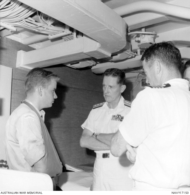 Rear Admiral (Rear Adm) Moore (centre), of the USN is paying a visit to