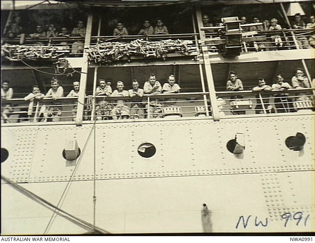 Darwin, NT. 1945-09-14. Prisoners of war (POWs) from Singapore line the ...