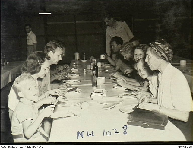 Darwin, NT. 1945-09. Dutch internees have a meal with crew of their ...