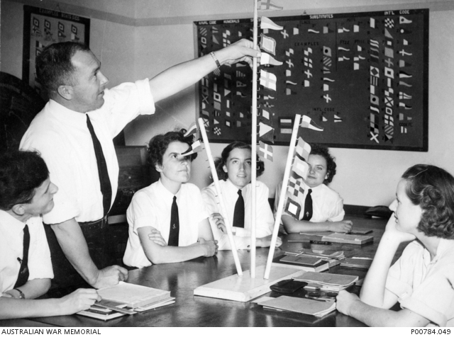c. 1944. Yeoman of Signals, Bruce Jackson, instructs a group of women ...