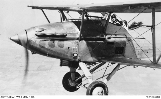 OVER RAAF POINT COOK, VICTORIA, 1941. HAWKER DEMON AIRCRAFT IN FLIGHT ...