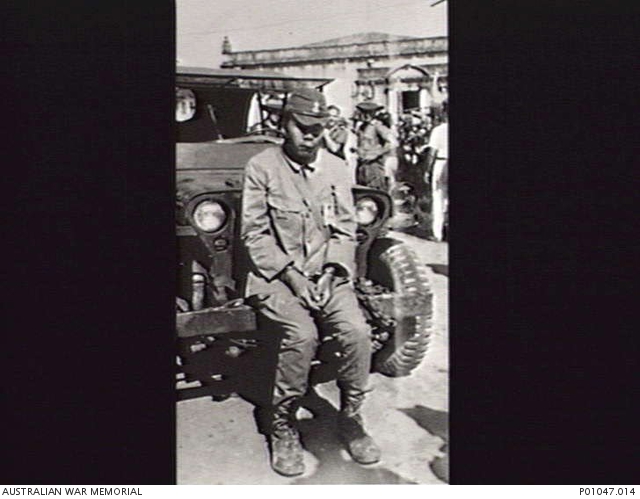 BORNEO, C. 1945-09. A FORMER JAPANESE GUARD FROM KUCHING PRISONER OF ...