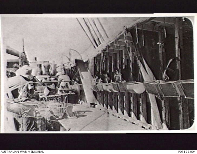 AT SEA, C. 1914-11. HORSES IN THEIR STALLS ON THE DECK OF THE TROOPSHIP ...