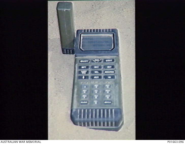 KUWAIT, 1991-03-18. A MAGELLAN GLOBAL POSITIONING SYSTEM (GPS), A HAND ...