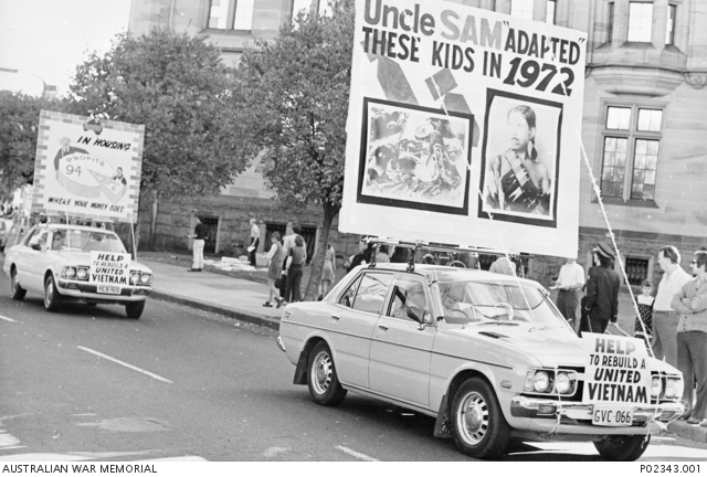 Carrying large protest banners on their front and on their roofs, two ...