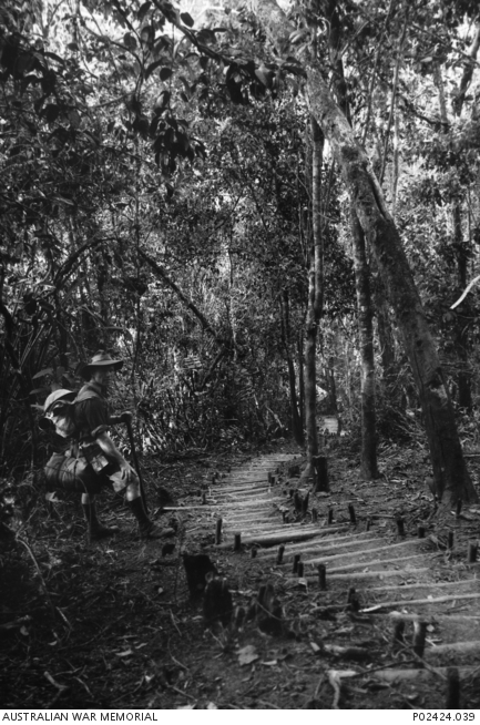 Imita Ridge, Papua, 1942-10. With a full pack on his back and a walking ...