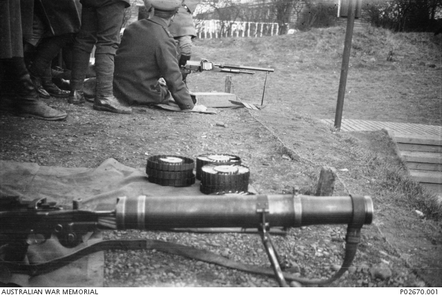 Men of No. 7 Squad, 86 Machine Gun Corps Course, grouped around a ...