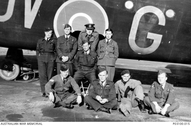 Group portrait of seven crew and two fitters in front of Handley Page ...