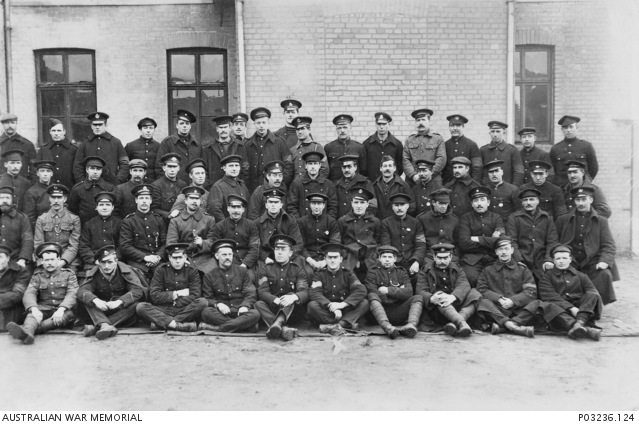 Outdoor portrait of large group of Prisoners of War (POW) at German POW ...