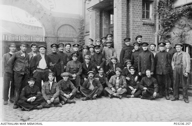Outdoor portrait of a group of allied Prisoners of War (POW) at Hamburg ...