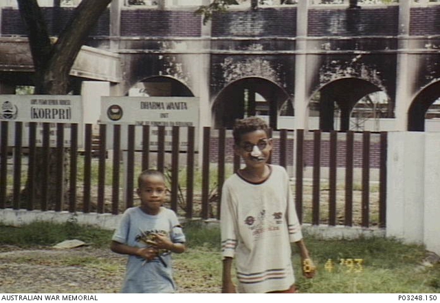 Dili, East Timor. 28 December 1999. Two Timorese children standing by ...