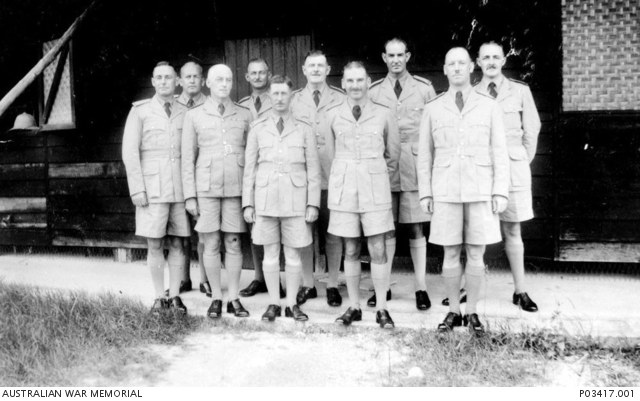 Outdoors group portrait of hut mates at Kallang. Identified is Pilot ...