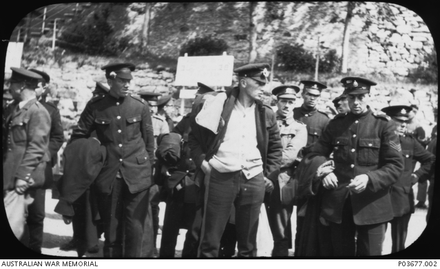 A group of unidentified soldiers arriving at the prisoner of war camp ...