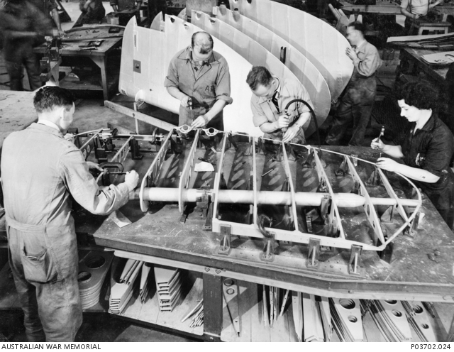 Unidentified workers assembling Beaufort rudders at a component plant ...