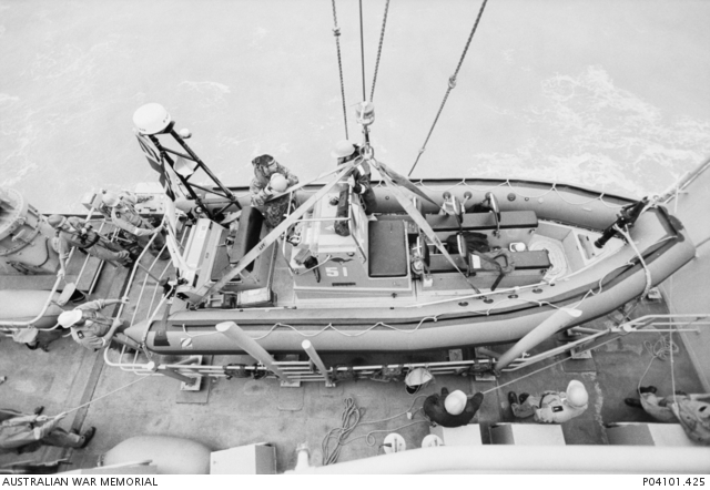 A Rigid-Hulled Inflatable Boat (RHIB) is lowered into the Khawr Abd ...