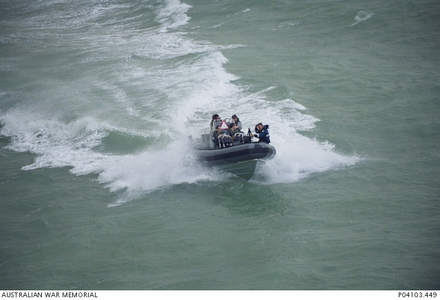 A boarding party from HMAS Kanimbla travel in a Rigid-Hulled Inflatable ...