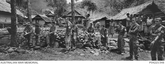Local villagers and members of 2nd Battalion, the Royal Australian ...