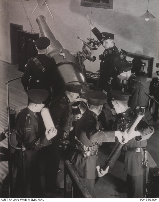 A detachment, 117 Heavy Battery, RAA(M), loading a six inch Coast