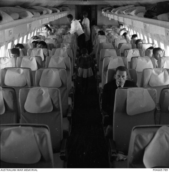 On board a QANTAS 707 from Sydney to Singapore. | Australian War Memorial