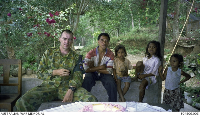 Informal group portrait of Captain (Capt) Gregory Michael Knowles ...