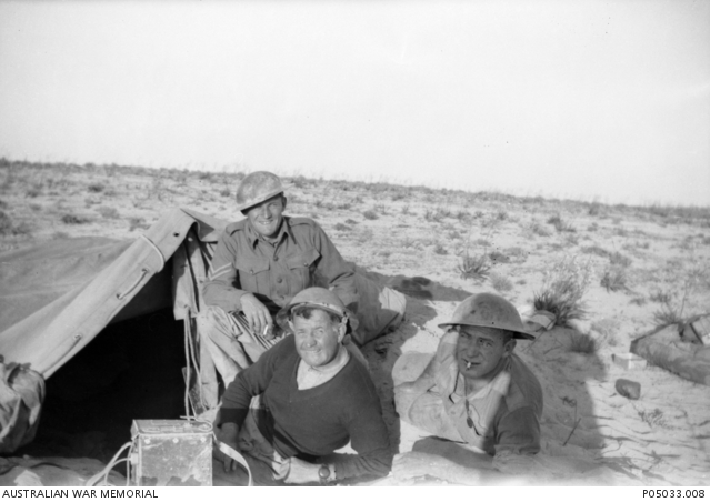 Three unidentified Australian signallers from the 6th Division, camped ...