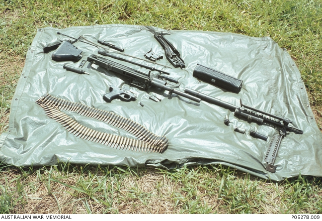 A stripped down M60 General Purpose Machine Gun and a 100 round belt of ...