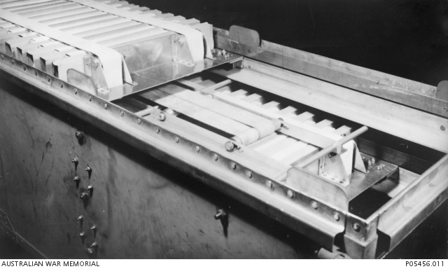 The follower mechanism on the top shelf of the rear left corner of a ...