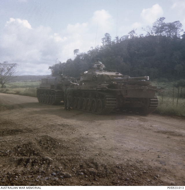 A Centuriion Mk V/1 tank being prepared for towing by a Centurion ...