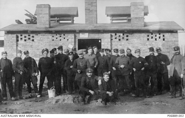 Outdoor portrait of a group of 25 unidentified allied Prisoners of War ...