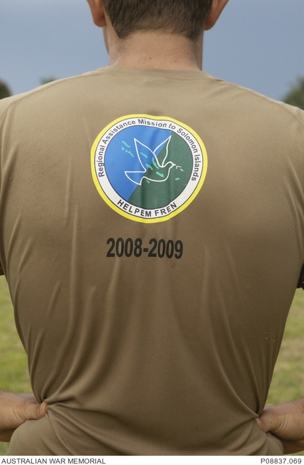 An Australian serviceman wears a RAMSI tshirt for a soccer game between