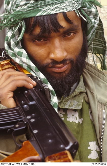 A Hezbi-Islami guerrilla fighter with his AK47. | Australian War