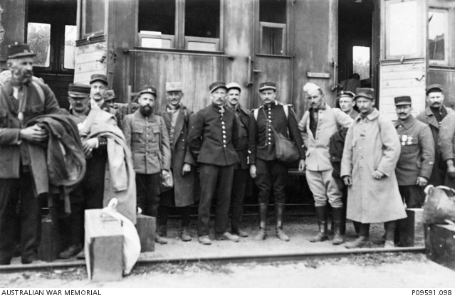 Informal outdoor portrait of thirteen unidentified French prisoners of ...