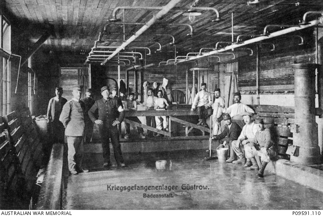 A large group of unidentified prisoners of war (POW) in the bathrooms ...