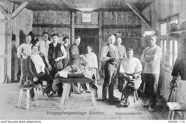 Informal group portrait of eleven unidentified prisoners of war (POW ...