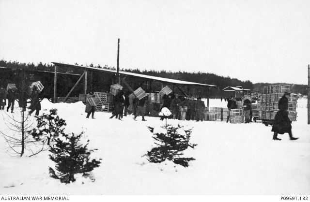 A group of unidentified allied prisoners of war (POW) moving packing ...