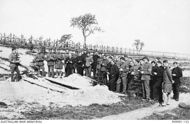 A large group of unidentified allied prisoners of war (POW) attending a ...