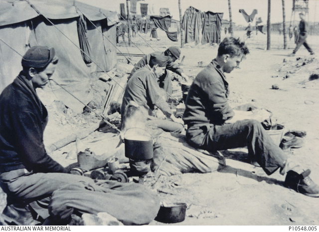 Prisoners of war (POW) brewing tea outdoors at Stalag VIII B (344 ...