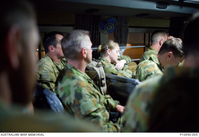 In the early morning ADF personnel travel on a bus to the Reception ...
