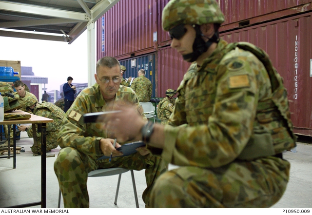 ADF personnel undertake weapons loading and unloading training at a ...