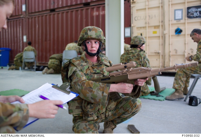 ADF personnel undertake weapons loading and unloading training at a ...