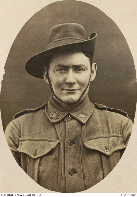 Studio portrait of James (Jim) Rhodes. | Australian War Memorial