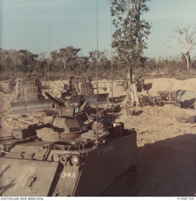 Earthmoving equipment and an M113 Armoured Personnel Carrier at Night ...