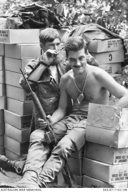 Vietnam. 1967-11. Captain Peter Stokes of Burwood, Vic, receives a hair ...