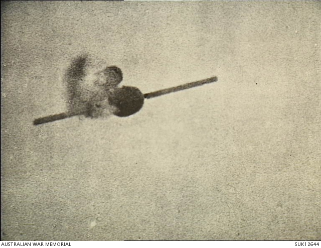 England. C. 1944-08. A V-1 flying bomb falters and slows down, smoke ...