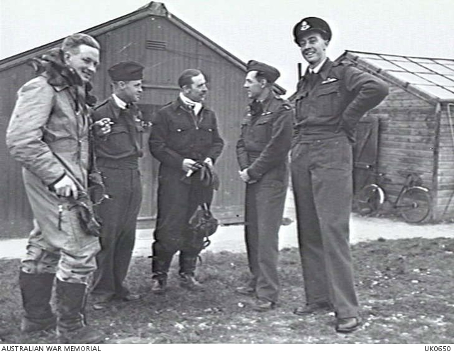 UPAVON, ENGLAND. 1943-10-05. A RAAF GROUP WITH AN RAF FLIGHT COMMANDER ...