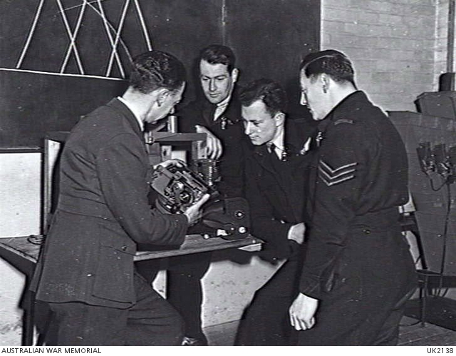 England. C. 1944-10. An instructor describing to aircrew the mechanism ...