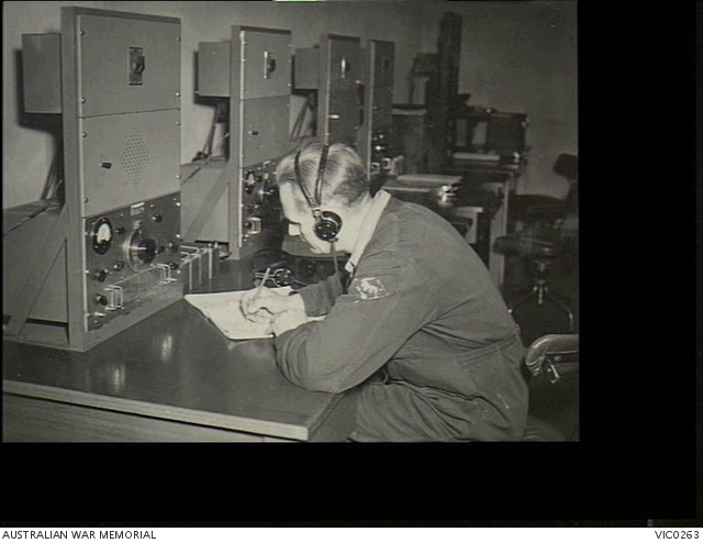 Canterbury, Vic. C. 1945-04. A RAAF radio operator recording radio ...