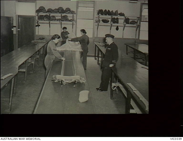 Point Cook, Vic. 1942-04-01. WAAAF fabric workers folding a parachute ...